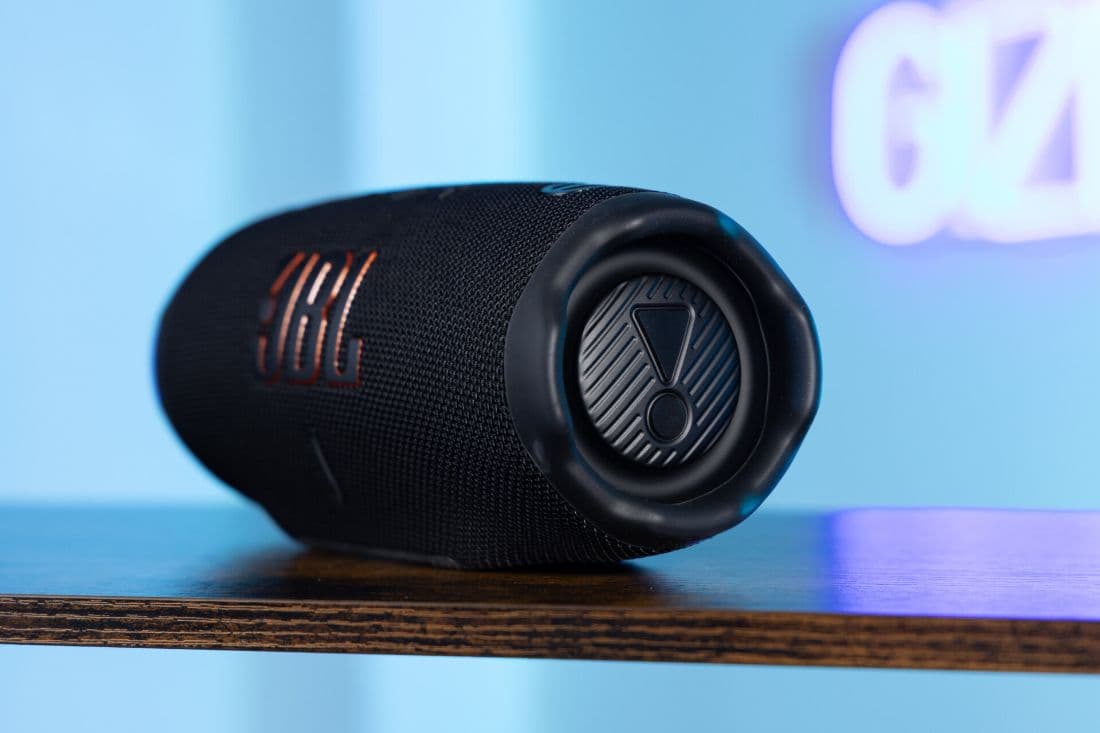 JBL Charge 6 in black, end-on view of the passive radiator
